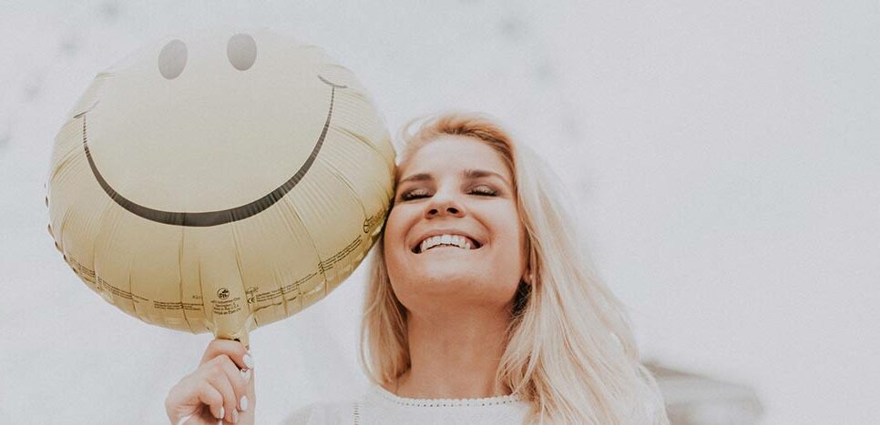 Happy lady with balloon, for Brand Archetypes